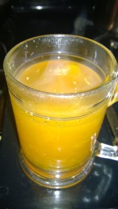 Grated ginger root in hot water