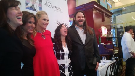 Molly  share a group hug and a group laugh with  Dominique Debroux of co founder of Big Belli Co, Melissa of the MOMS and filmmaker Christopher Henz