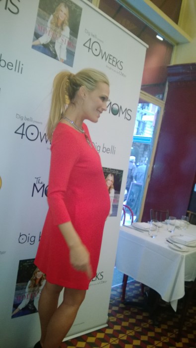 RED HOTTT! Molly Sims who is 8-months  pregnant stuns in red.